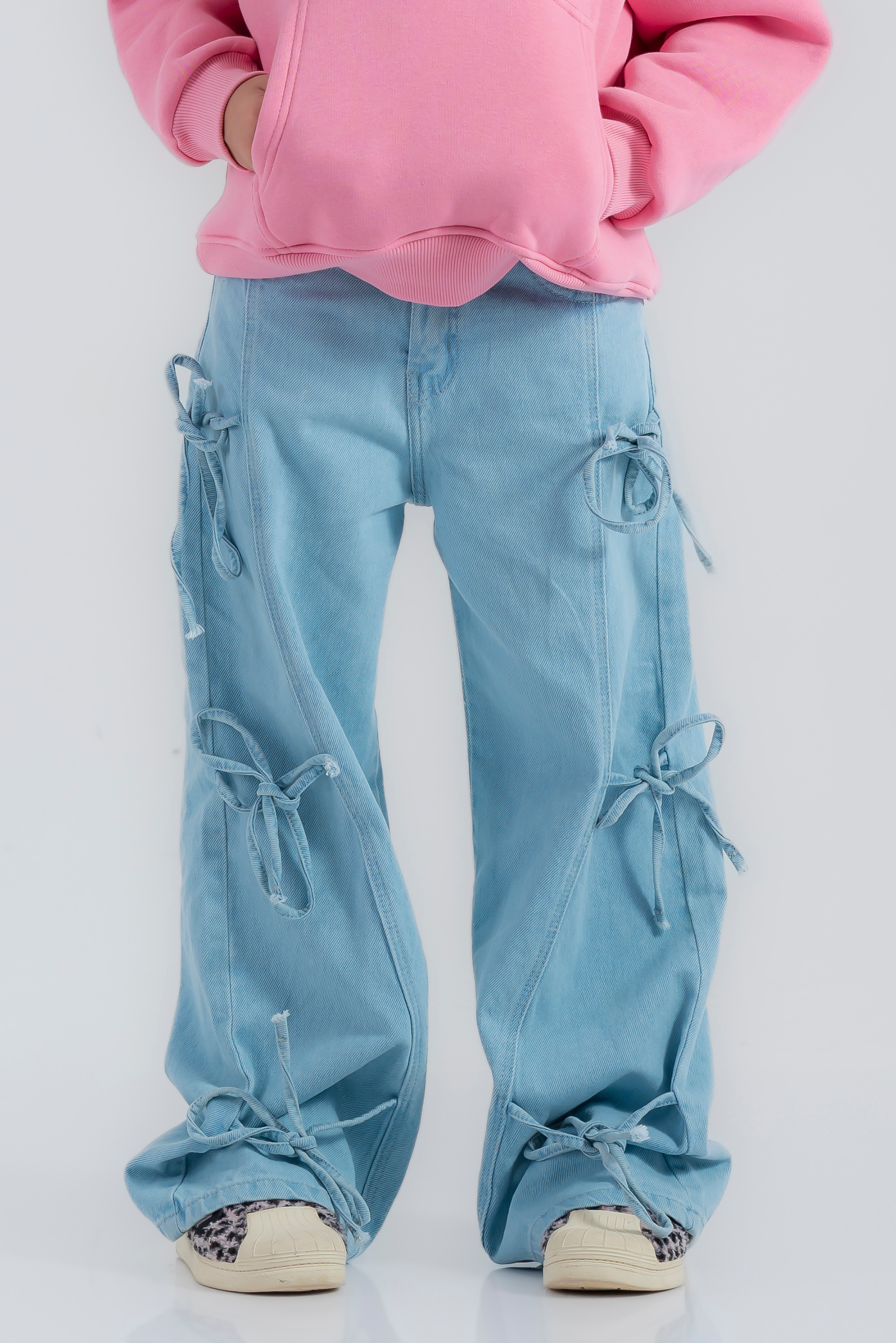 Wide-leg cargo jeans featuring side lace-up details